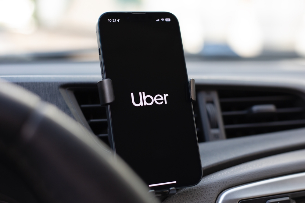 Technology (names J - Z) - Uber Technologies Inc logo on phone-by DenPhotos via Shutterstock